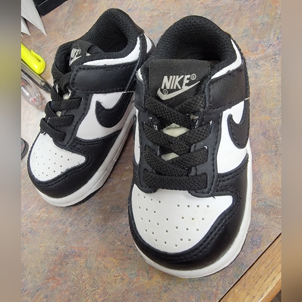 Nike dunk low. Size 4c baby shoes. Black an white. Like new